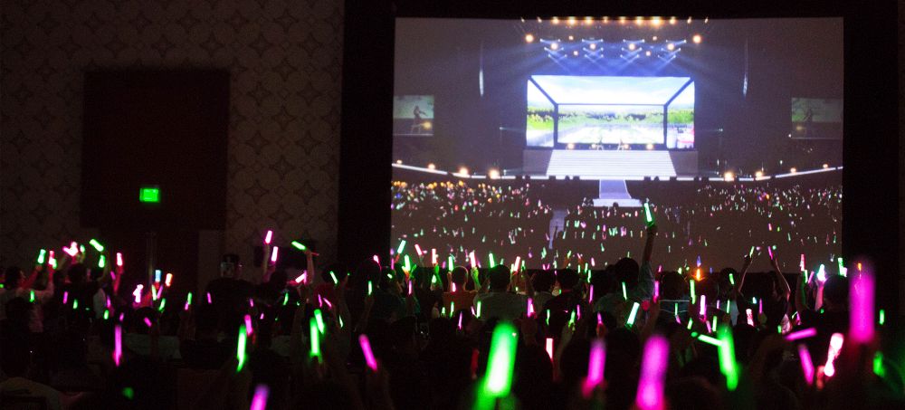 Anime Expo Concertgoers waving colourful Light Sticks to support their favourite Artists.