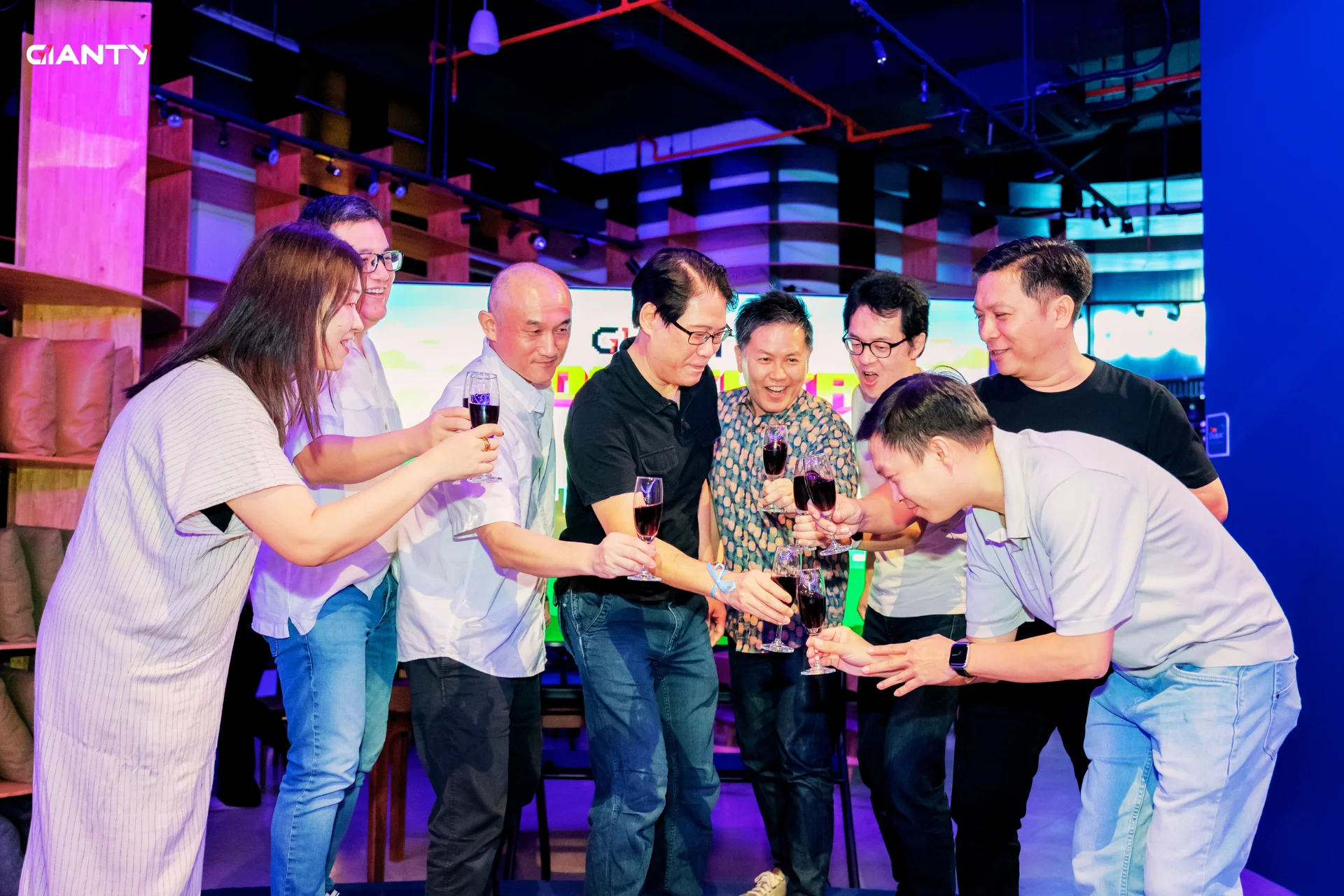 The Board of Directors and distinguished guests raise a toast to officially kick off the party.